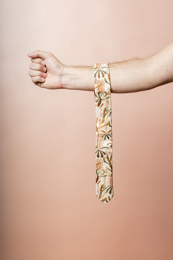 Elegant nude cotton tie featuring a Grass Tree pattern in earthy tones of mocha, burnt orange, sage green, and terracotta, perfect for sophisticated events