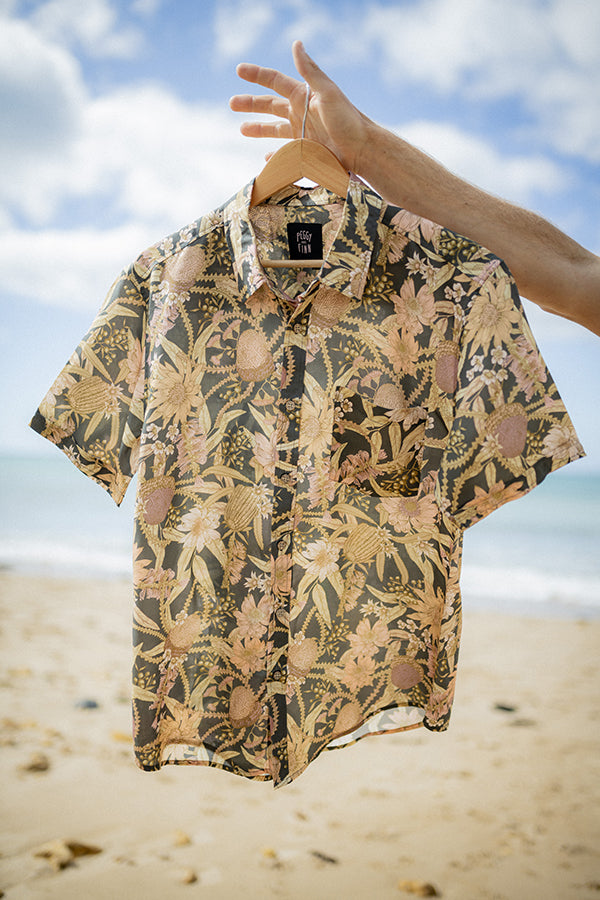 Casual summer shirt with a vibrant botanical pattern, perfect for outdoor celebrations and beach gatherings