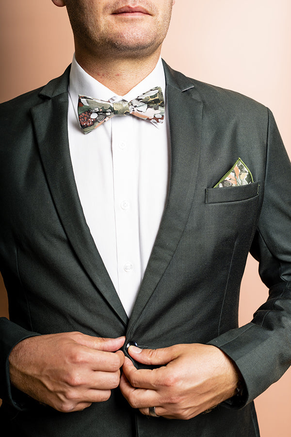 Modern and stylish bow tie featuring a detailed spotted gum leaf print in earthy tones of green and brown, reflecting the natural beauty of this Australian native tree