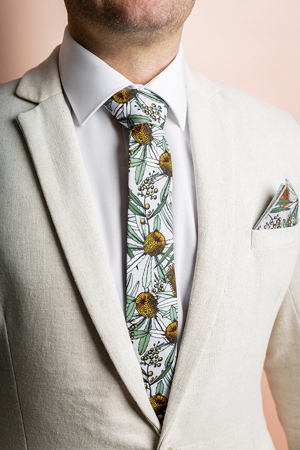 Chic Banksia Grey tie made from 100% cotton, showcasing detailed native Australian flora in soft green and yellow on a grey background