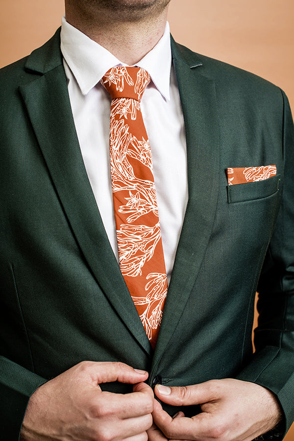 Burnt orange 100% cotton tie with detailed kangaroo paw design