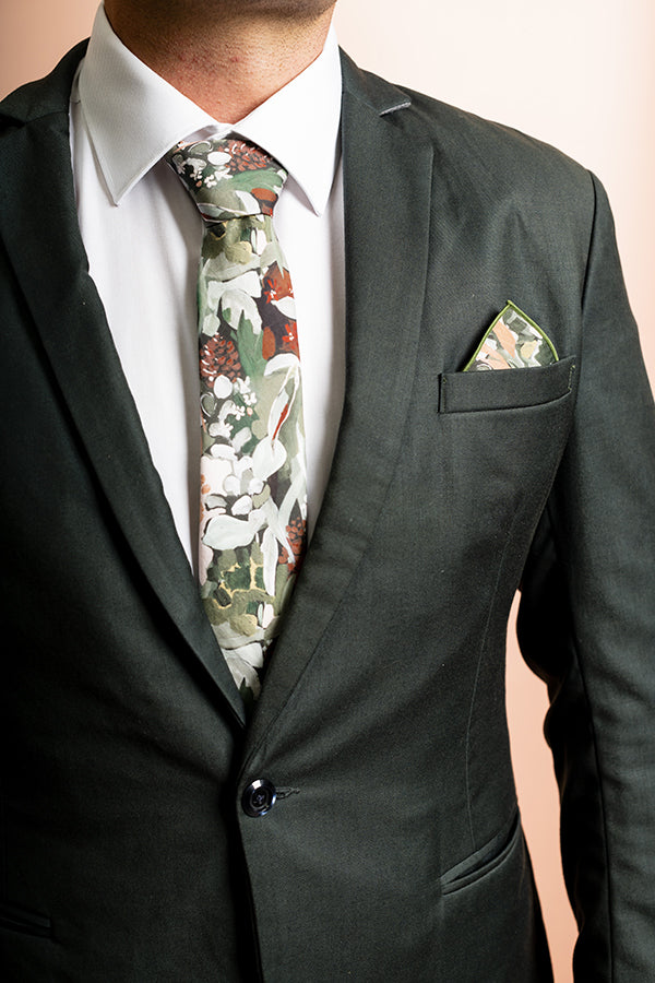Green cotton tie featuring a detailed spotted gum leaf print, highlighting the intricate patterns and natural beauty of this Australian native plant