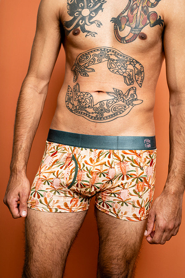 Men's eco-friendly bamboo underwear in nude with Grass Tree print in mocha, burnt orange, and sage green
