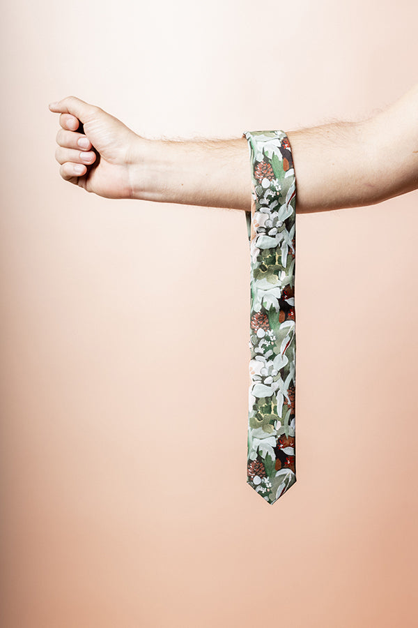 Elegant men&#39;s tie in green with a sophisticated spotted gum leaf design, perfect for adding a touch of nature-inspired style to formal wear