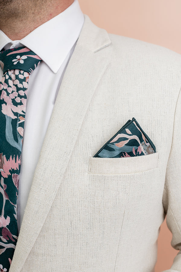 Stylish 100% cotton pocket square in teal with a detailed pattern of Australian Wax Flowers and other blooms, perfect for adding a pop of color to any suit